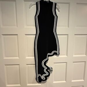 Sleeveless Black Dress with White Trim and Asymmetric Ruffle